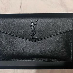 Black YSL clutch slightly used I have the tag and dust bag and original box
